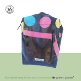 green-goose Rugtas Silnice backpack in black with multicolor circle pattern and a pink diagonal strap.