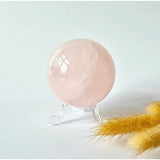 Rose quartz sphere by Moonlight Gemstones, 63mm, 350g on a clear stand