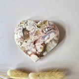 Heart-shaped pink amethyst druzy gemstone, 8–10 cm, with white crystalline clusters.