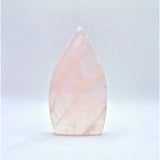 Rose quartz drop-shaped standing crystal with pale pink hues.