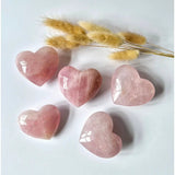 Rose quartz hearts set of five in pink, 7–10 cm each, by Moonlight Gemstones.