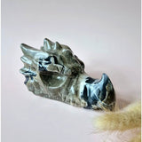Dragon skull carved from UV-reactive volcano agate; blue-green marbled gemstone, Moonlight Gemstones, 600 g