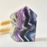 Fluorite sculpture with rough edge in purple, green and blue hues by Moonlight Gemstones