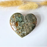 Heart-shaped drusy moss agate stone, green-gray with orange inclusions, 6–8 cm