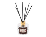 Scent Junkie Geurdiffuser Noël 100ml reed diffuser by Home Bound, Festive Cinnamon, with black reeds and gold cap